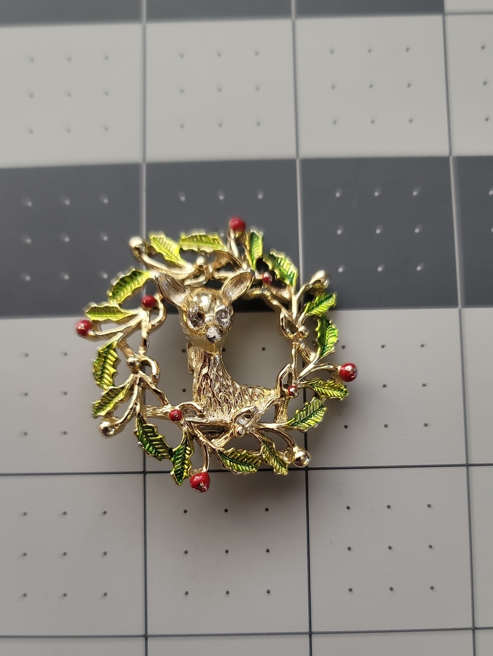 Gold-Tone Deer Wreath Brooch with Green Enamel Leaves and Red Berry Accents